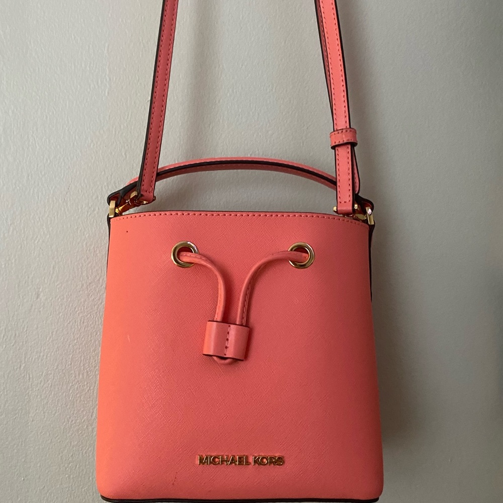 Michael kors peach color purse never used basically brand new!